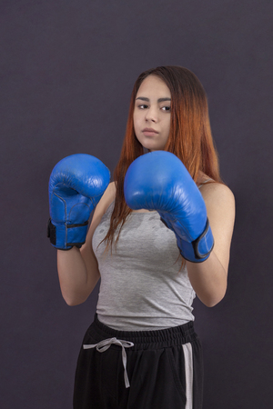 copyspace women's boxing girl boxer stands in boxing glovesの写真素材