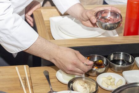 cooking Korean dishes, ingredients for meals. cook cooks in the kitchen