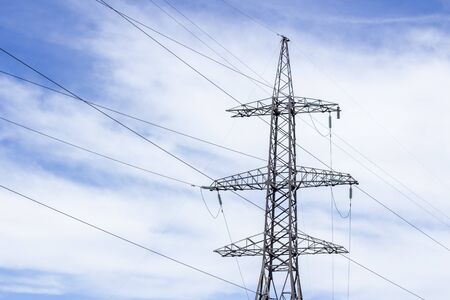 Power Tower. High voltage lines and power pylons. High voltage power lines installing on high electric post connectedの写真素材