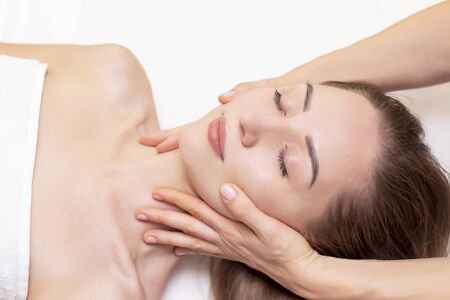 Massage and body care. Spa body massage woman hands treatment. Woman having massage in the spa salon for beautiful girlの写真素材