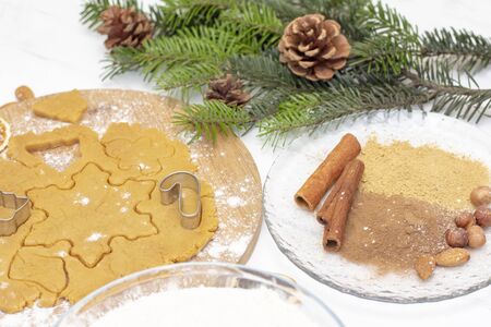 Christmas food. Homemade gingerbread cookies with ingredients for Christmas baking and kitchen...