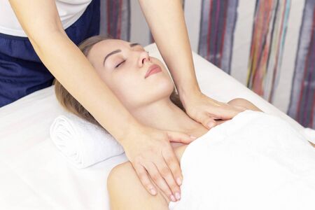 Massage and body care. Spa body massage woman hands treatment. Woman having massage in the spa salon for beautiful girlの写真素材