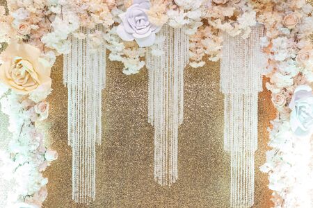 Gentle design of the photo zone from large flowers from foamiran, beige delicate colors, goldenの写真素材