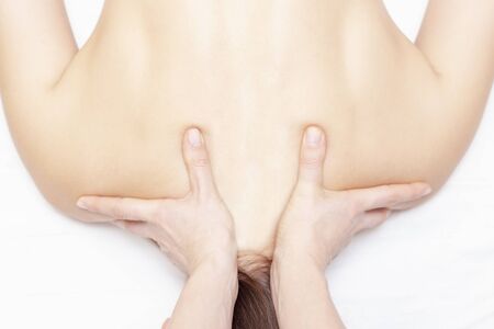 Massage and body care. Spa body massage woman hands treatment. Woman having massage in the spa salon for girlの写真素材