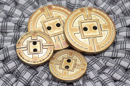 metal buttons are on a gray background. retro background. atelier and sewing concept. close up