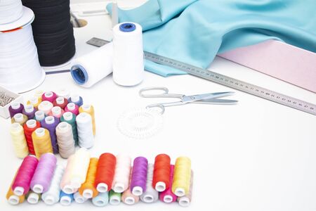 sewing Studio. A set of items for needlework: threads, needles, pins, scissors, tape measure, etc.