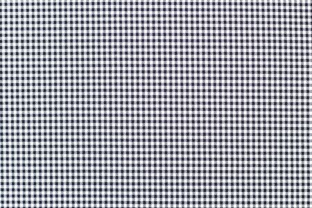 black and white cage made of fabric. squared fabric background texture. close-up.
