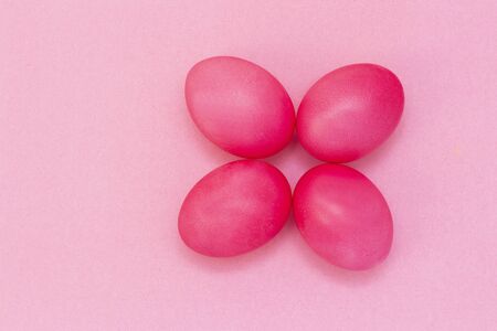 Easter eggs of pink color on a pink background. Happy easter.