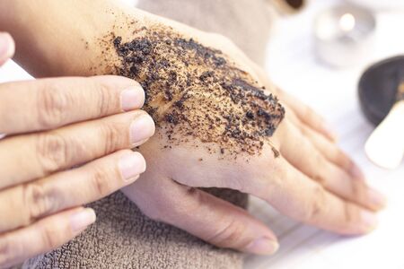 Natural scrub made from coffee and sugar. hand peeling sugar scrub with coffee. spa hand treatment.