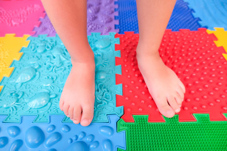 childrens feet on orthopedic mats, prevention of flat feet.の写真素材