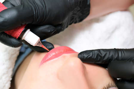 Close up of permanent lip makeup. lip tattoo. Beautiful lipsの写真素材