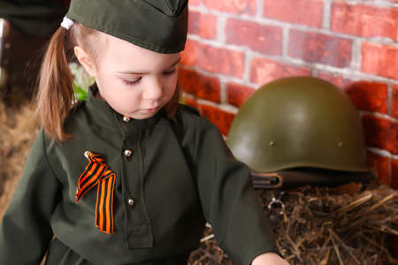 Portrait of a russian child girl in uniform. Holiday Victory Day May 9thの写真素材