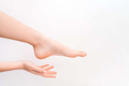 Female feet. Spa, scrub and care. Pedicure and depilation concept.の写真素材