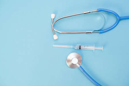 stethoscope for a doctors examination on the background of a medical laboratory health table with space for text. blue background and stethoscopeの写真素材