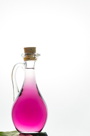small glass jar with lavender essenceの写真素材