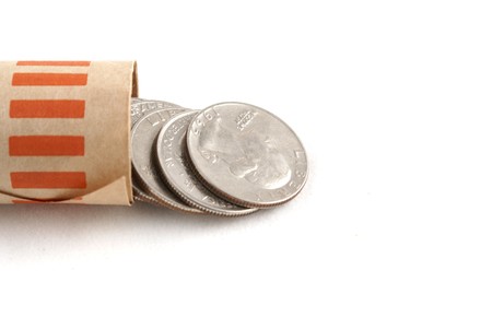 quarters spilling out of paper rollの写真素材