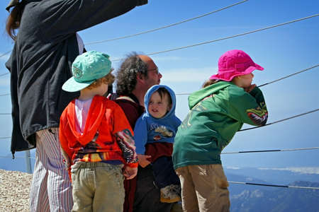 A large family on a viewing platform in the mountains, Kemer, Turkey - May, 2011.のeditorial素材