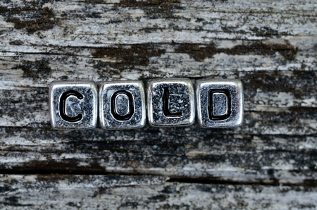 cube word cold on wooden tableの写真素材