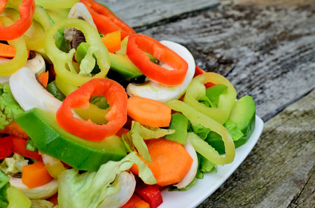 salad in dish on wooden tableの写真素材