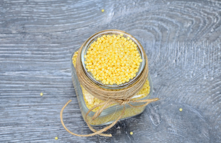 millet seed on gray wooden tableの写真素材