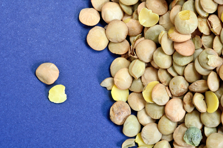 green lentil on blue tableの写真素材