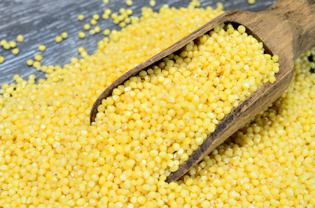millet seed on gray wooden table
