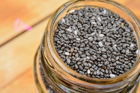 chia seed on brown wooden tableの写真素材