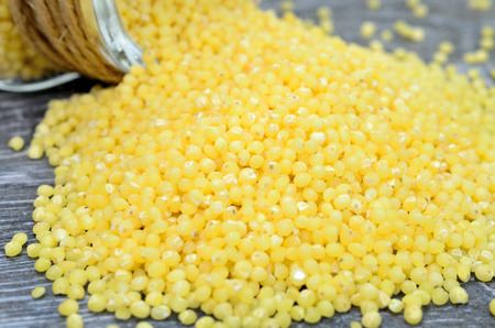 millet seed on gray wooden tableの写真素材