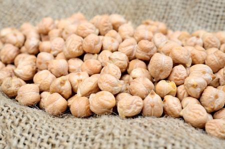 pile of chickpea on sackの写真素材