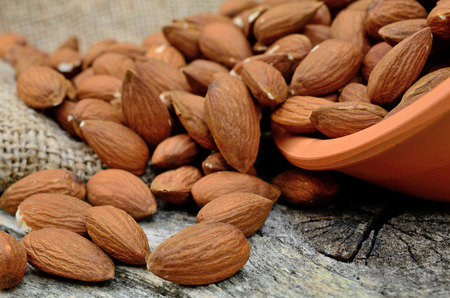 almond on wooden tableの写真素材