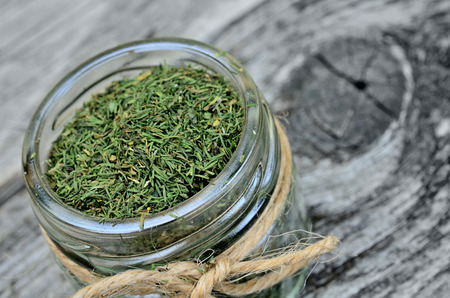 dried dill on wooden tableの写真素材