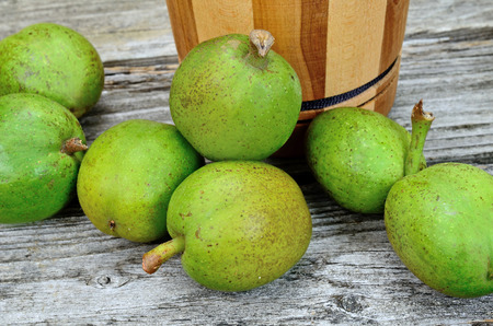 green walnut on wooden table