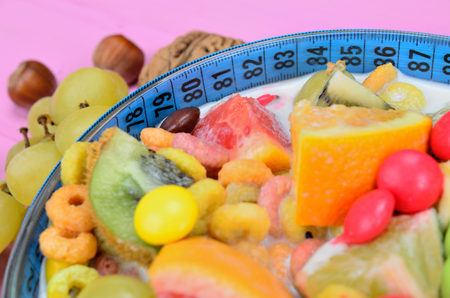 cereal with fruit on pink wooden tableの写真素材