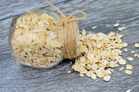 oat cereal on gray wooden tableの写真素材
