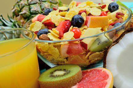 cornflake with fruit on blue wooden table