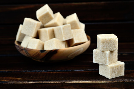 brown sugar on wooden tableの写真素材