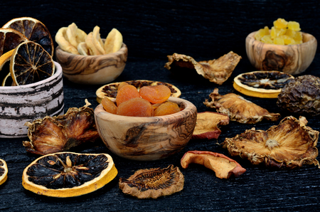 dried fruits on black wooden tableの写真素材