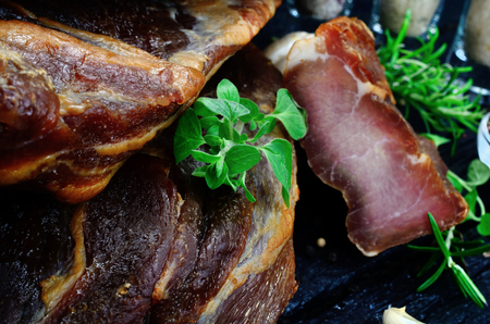 smoked meat on black wooden table