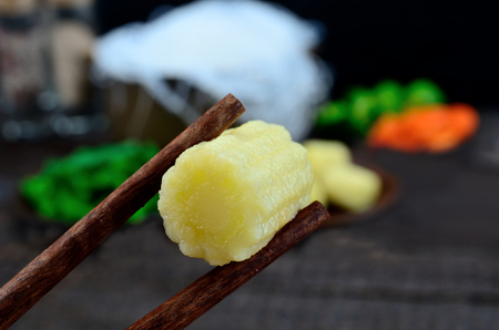 corn in asian wooden stick on tableの写真素材