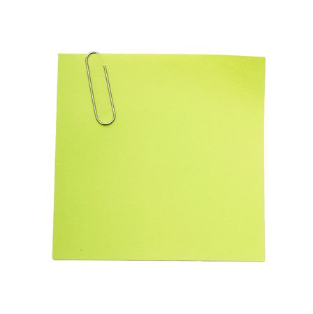 green reminder note with paper clipの写真素材