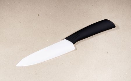 White ceramic knife on draft paper backgroundの写真素材