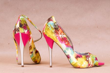 Pair of bright shoes on paper backgroungの写真素材