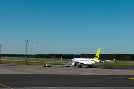 RIGA, LATVIA - JUNE 2010. Airplane in Riga International airport (RIX), Latviaのeditorial素材
