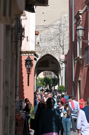 Taormina, Italy - May 1, 2011: Always the populous, Corso Umberto - main street in old Taormina, famous tourist resort, the most luxury town on Sicilian coastline, Sicily, Italyのeditorial素材