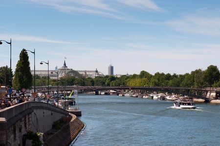 PARIS, FRANCE - MAY 28, 2011: Seine river with tourists ship in Paris on May 28, 2011, France. Every day thousands of tourists use this ships to observe the Parisのeditorial素材