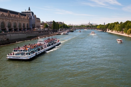 PARIS, FRANCE - MAY 28, 2011: Seine river with tourists ship in Paris on May 28, 2011, France. Every day thousands of tourists use this ships to observe the Parisのeditorial素材