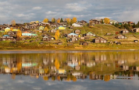Big village on a hill over the river in Komi region, northern Russia.の写真素材