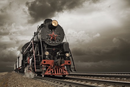 steam engine and carriages in full steam