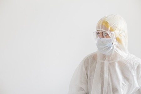 Scientist in protective wear with glasses. Woman scientist on white backgroundの写真素材