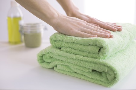 Stack of green bath towelsの写真素材